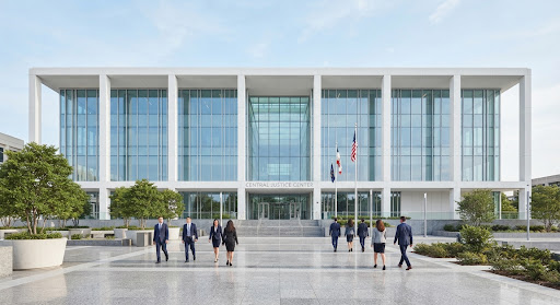 Modern institutional building representing structured compliance review.